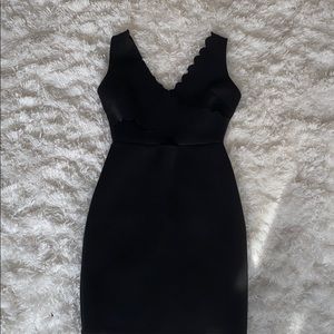 Black “Aqua” dress with cutout. size: small